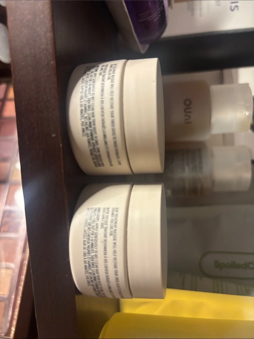 OUAI cream moisturizer jars in off-white